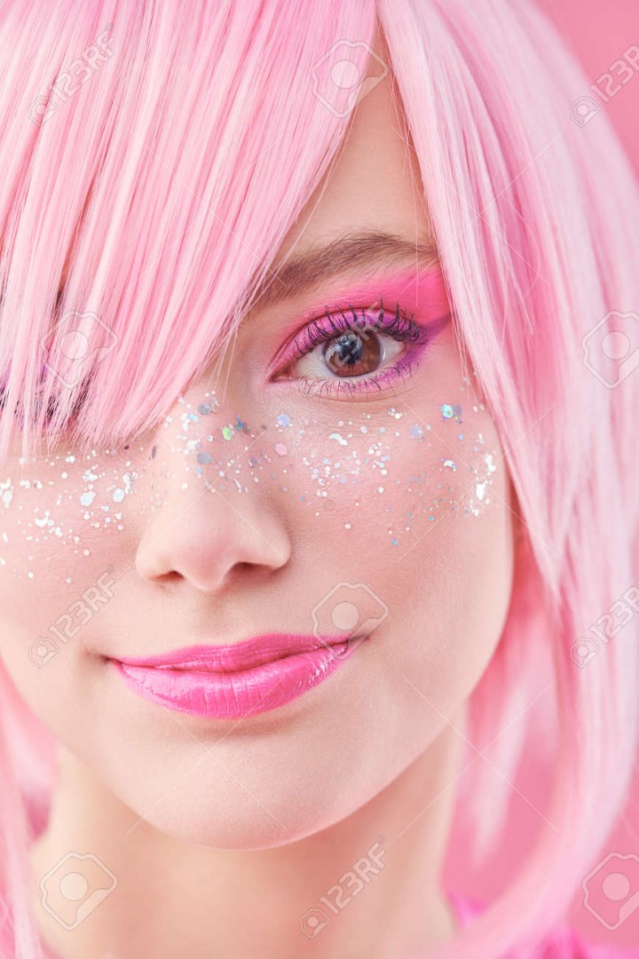 188491643-portrait-of-a-pretty-teen-girl-with-pink-hair-and-bright-pink-makeup-with-glitter-freckles-asian.jpg